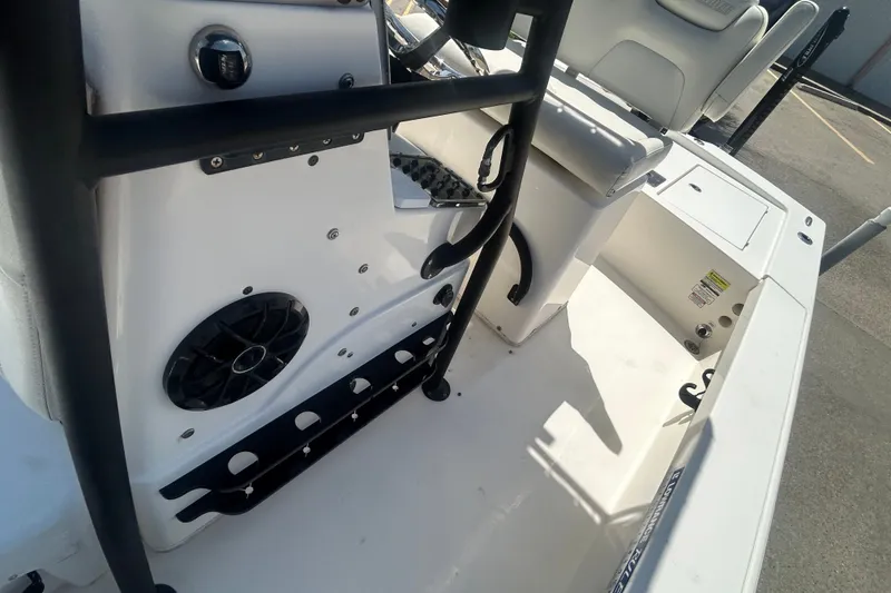 Slide: The Image of Interior view of a 2013 Pathfinder 2300 HPS boat, featuring seating and speaker system. - 10