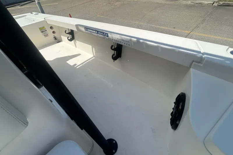Slide: The Image of Interior view of a 2013 Pathfinder 2300 HPS boat, showcasing storage and seating area. - 11
