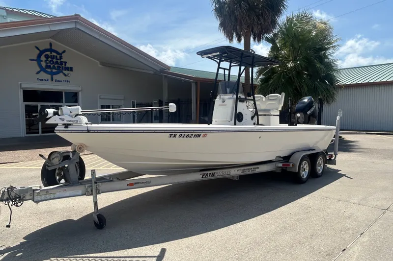 Slide: The Image of 2013 Pathfinder 2300 HPS boat on trailer outside Gulf Coast Marine building. - 2
