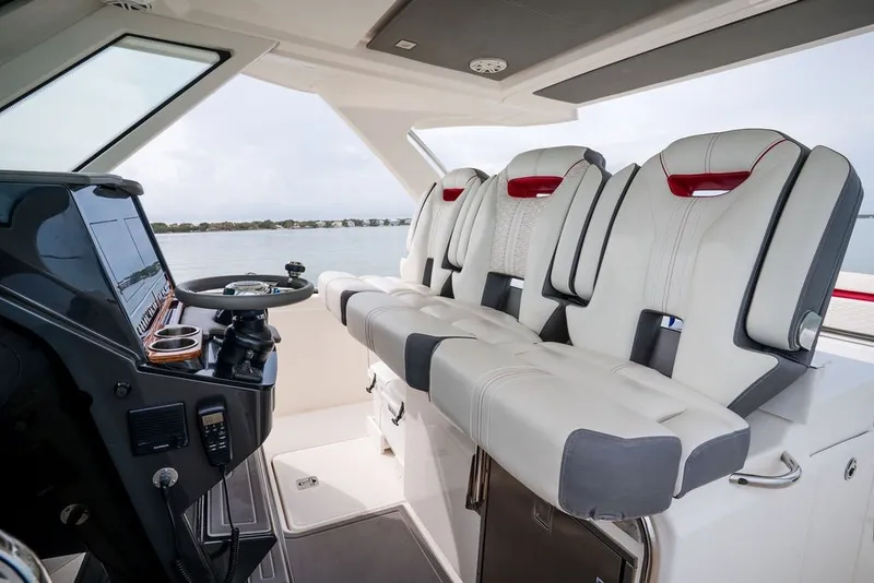 Slide: The Image of Luxurious interior of 2020 Tiara Sport 34 LS boat with modern seating and helm. - 23