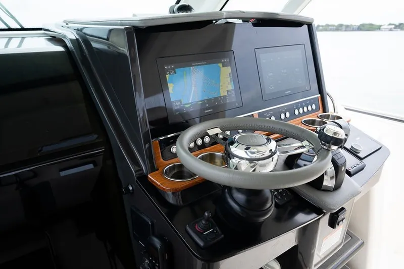 Slide: The Image of Helm of 2020 Tiara Sport 34 LS boat with navigation screens and controls. - 24