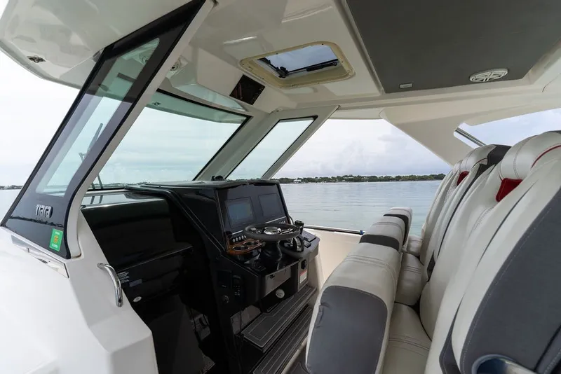 Slide: The Image of Interior view of 2020 Tiara Sport 34 LS boat with modern helm and seating. - 22