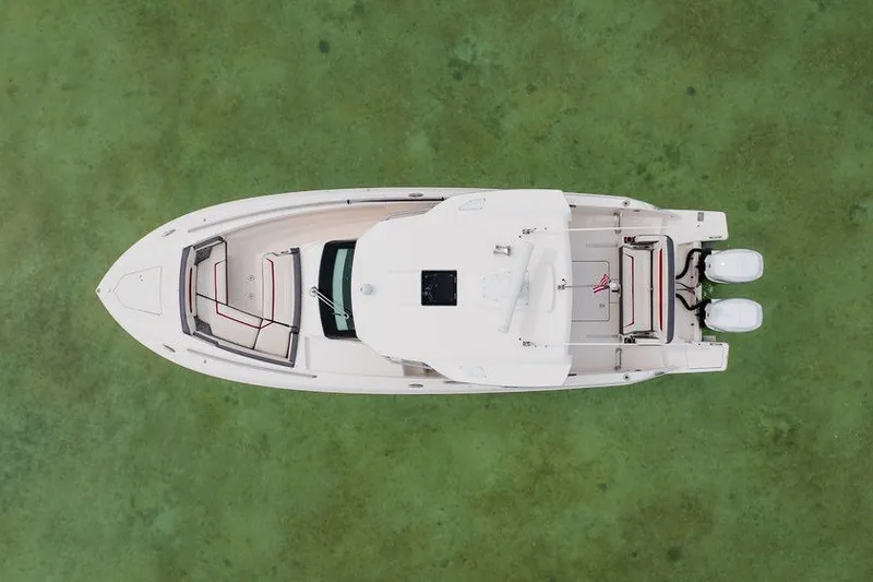 Slide: The Image of Overhead view of 2020 Tiara Sport 34 LS boat on green water. - 16
