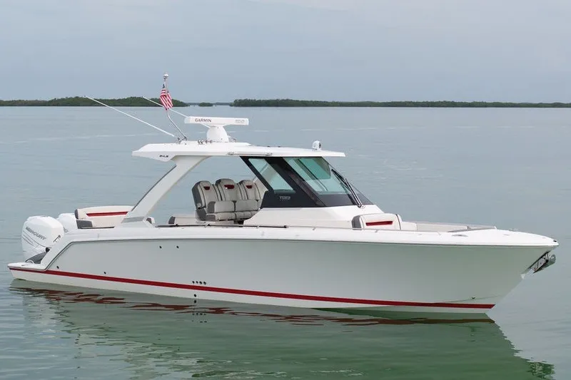 The Image of 2020 Tiara Sport 34 LS boat on calm water, showcasing sleek design and modern features. - 0