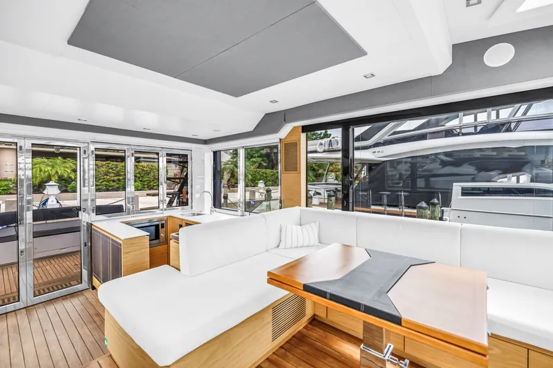 Slide: The Image of Luxurious interior of 2022 OKEAN 50 Flybridge yacht with modern seating and wooden accents. - 33