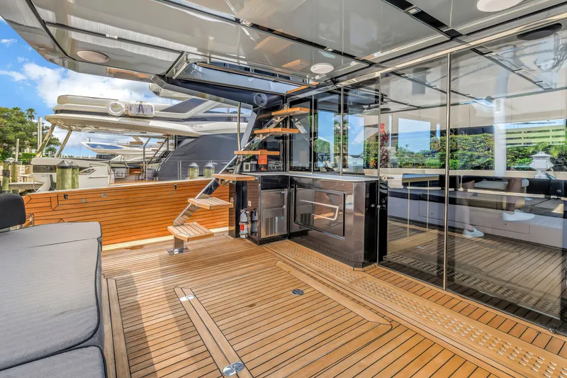Slide: The Image of Luxurious 2022 OKEAN 50 Flybridge yacht with sleek wooden deck and modern amenities. - 15