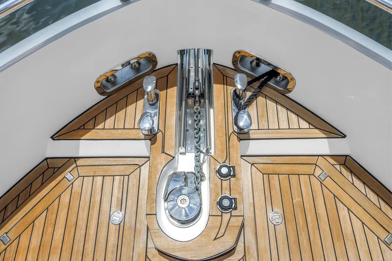 Slide: The Image of Bow deck of 2022 OKEAN 50 Flybridge yacht with teak flooring and anchor system. - 59