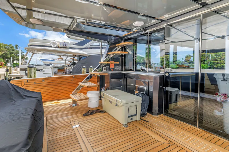 Slide: The Image of Luxurious 2022 OKEAN 50 Flybridge yacht with sleek wooden deck and modern amenities. - 93