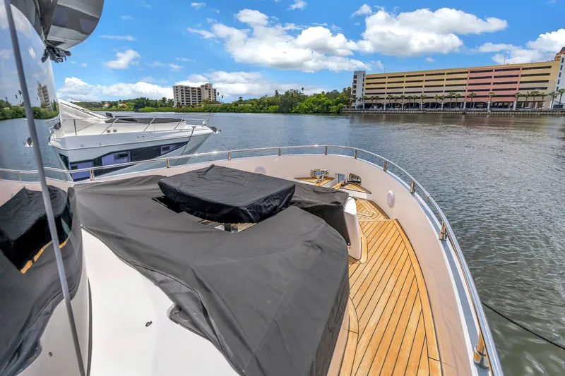 Slide: The Image of Luxurious 2022 OKEAN 50 Flybridge yacht docked on a sunny day. - 94