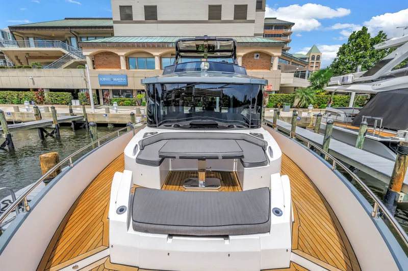 Slide: The Image of 2022 OKEAN 50 Flybridge yacht docked at marina with modern design and spacious deck. - 54