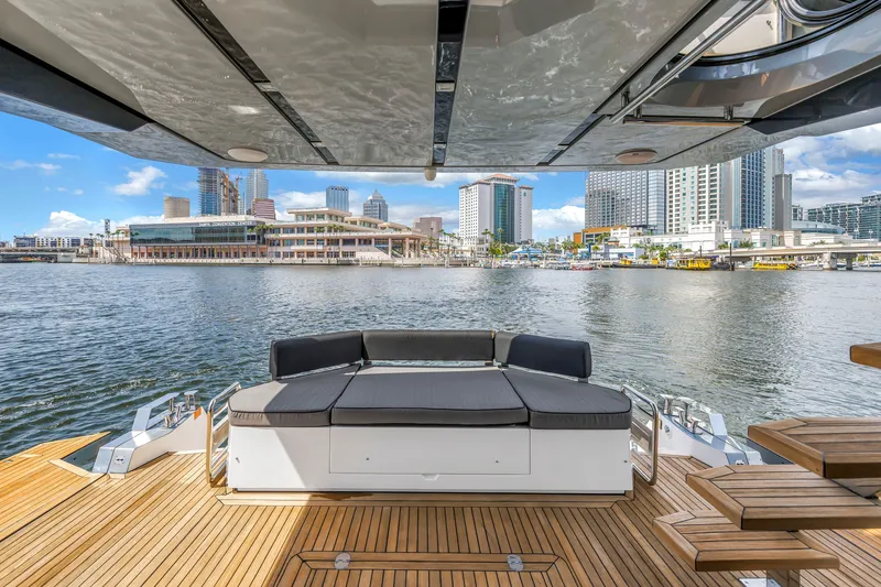 Slide: The Image of Luxury OKEAN 50 Flybridge yacht with city skyline view, 2022 model. - 19