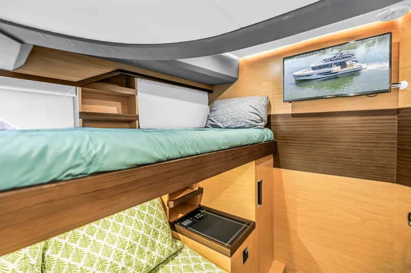 Slide: The Image of Interior of 2022 OKEAN 50 Flybridge yacht with bunk bed and wall-mounted TV. - 43