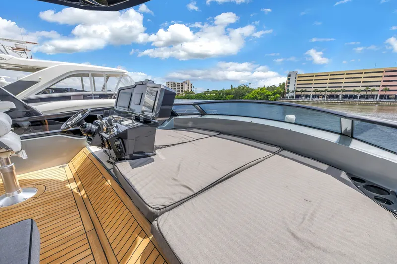 Slide: The Image of Flybridge of 2022 OKEAN 50 yacht with modern controls and waterfront view. - 72