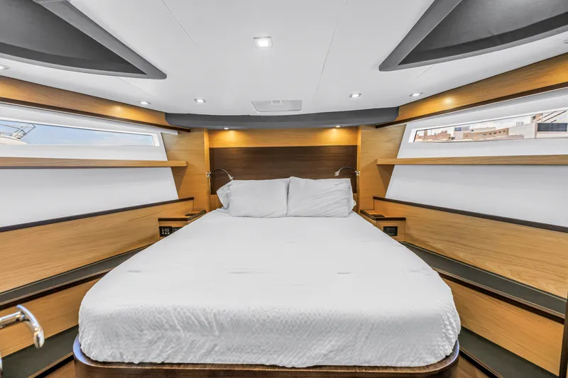 Slide: The Image of Luxurious cabin interior of 2022 OKEAN 50 Flybridge yacht with modern design and cozy bedding. - 38