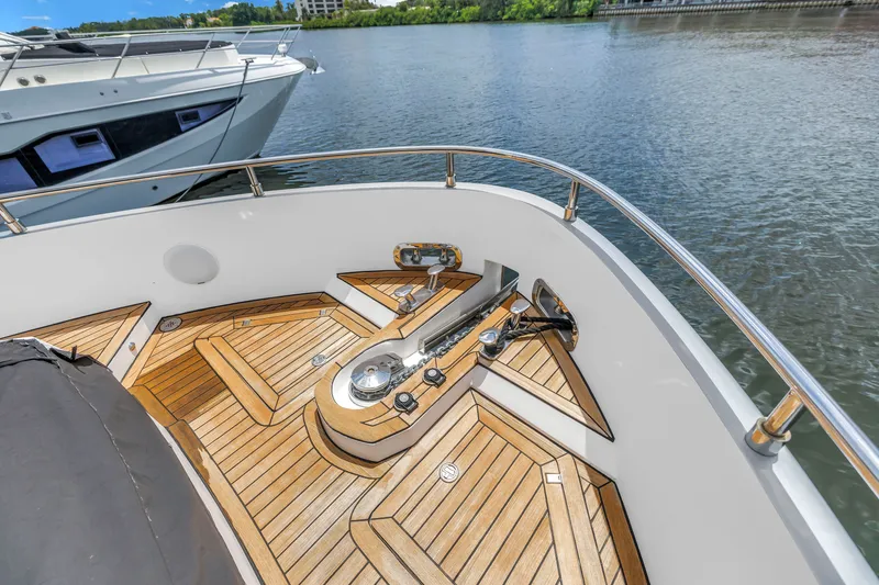 Slide: The Image of Bow deck of 2022 OKEAN 50 Flybridge yacht with teak flooring and anchor system. - 52