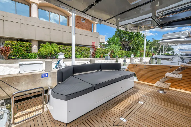Slide: The Image of Luxury OKEAN 50 Flybridge yacht deck with sleek seating, 2022 model. - 18