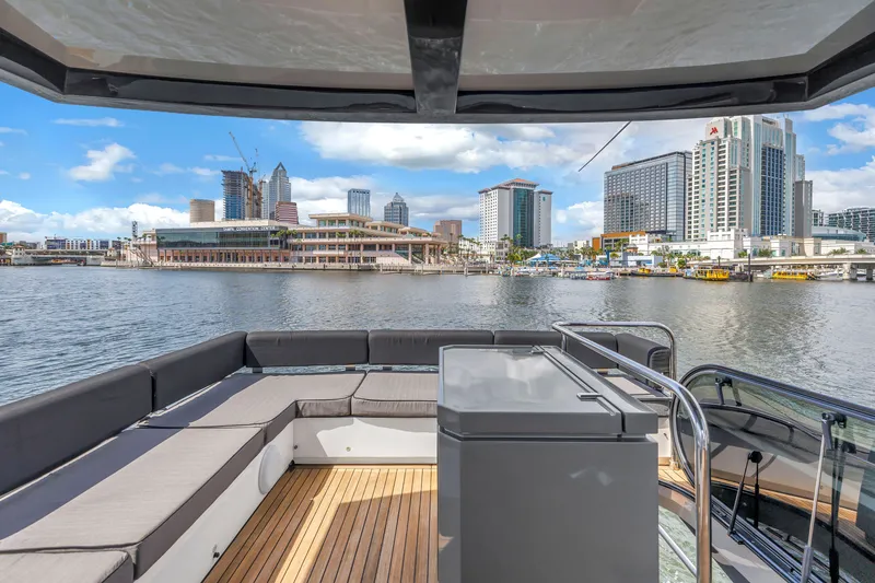 Slide: The Image of Flybridge view from 2022 OKEAN 50 yacht, overlooking city skyline and waterfront. - 85