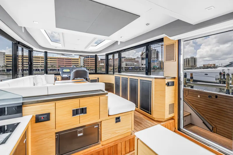 Slide: The Image of Luxurious interior of 2022 OKEAN 50 Flybridge yacht with modern design and panoramic windows. - 28