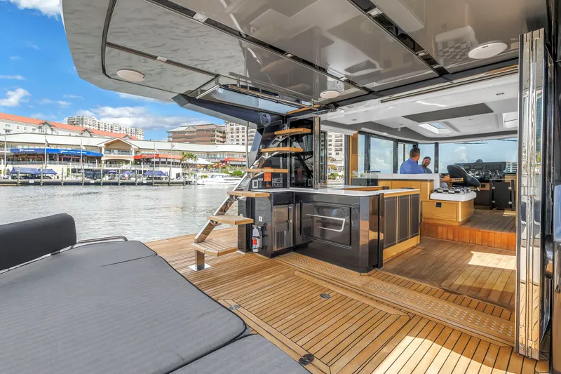 Slide: The Image of Luxurious 2022 OKEAN 50 Flybridge yacht interior with modern design and waterfront view. - 16