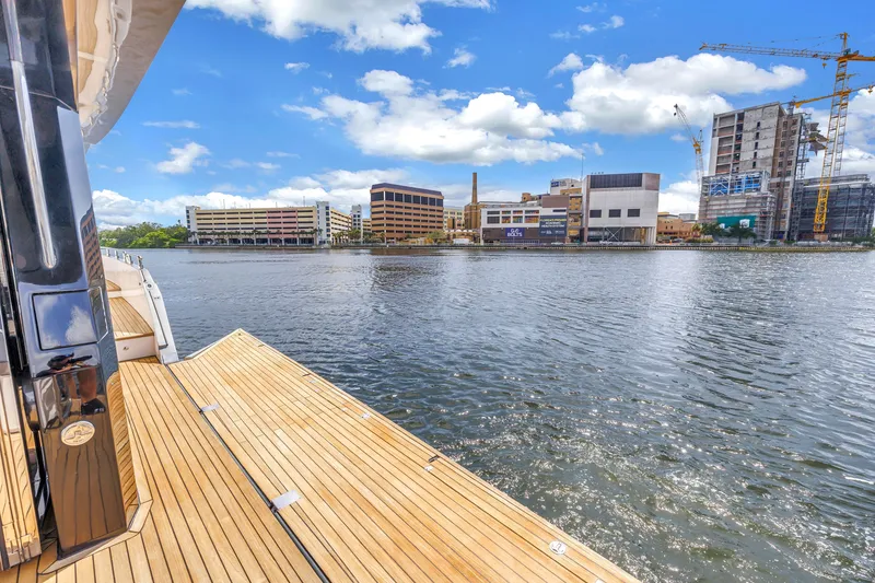 Slide: The Image of Luxury OKEAN 50 Flybridge yacht docked by urban waterfront, 2022 model. - 80