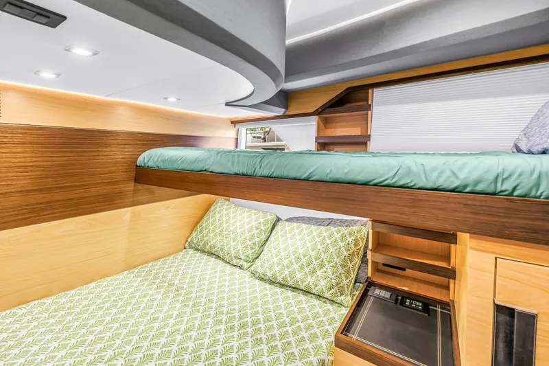 Slide: The Image of Luxurious cabin interior of 2022 OKEAN 50 Flybridge yacht with modern bunk beds. - 44