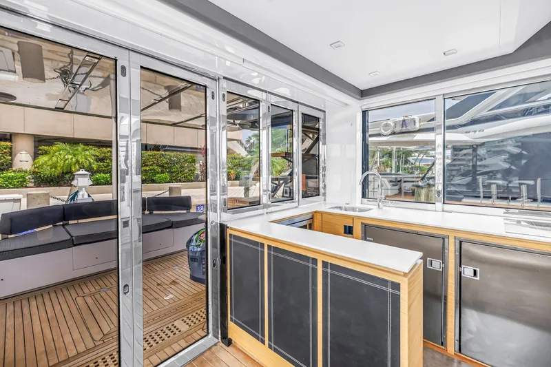 Slide: The Image of Luxurious interior of 2022 OKEAN 50 Flybridge yacht with modern kitchen and sleek design. - 26