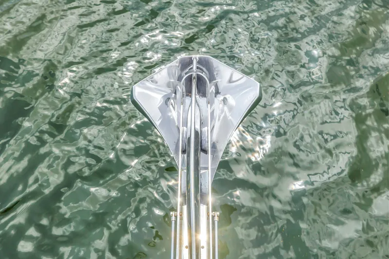 Slide: The Image of Anchor of 2022 OKEAN 50 Flybridge yacht on shimmering water surface. - 61