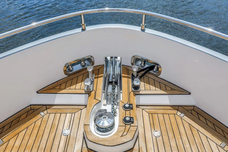 Slide: The Image of Bow deck of 2022 OKEAN 50 Flybridge yacht with teak flooring and stainless steel fittings. - 60