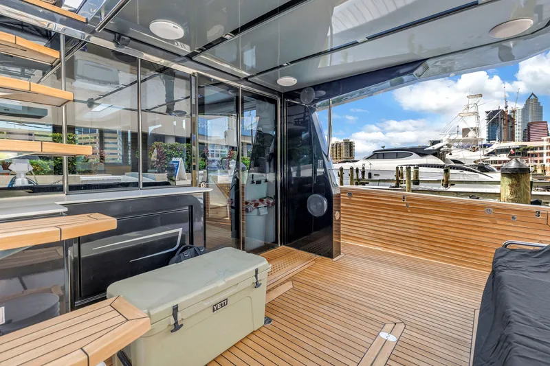 Slide: The Image of Luxurious 2022 OKEAN 50 Flybridge yacht with sleek wooden deck and modern design. - 90