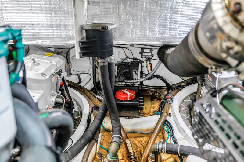 Slide: The Image of Engine room of 2022 OKEAN 50 Flybridge yacht with visible machinery and components. - 105