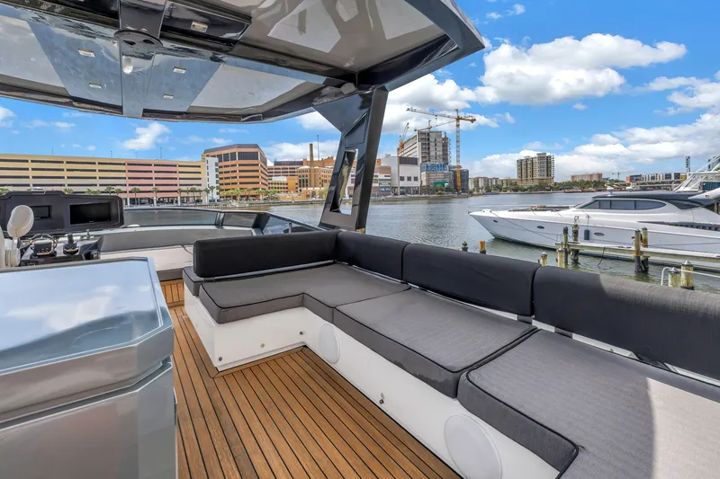 Slide: The Image of Luxurious 2022 OKEAN 50 Flybridge yacht with spacious seating, docked in a vibrant marina. - 66
