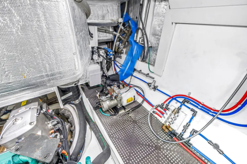 Slide: The Image of Engine room of 2022 OKEAN 50 Flybridge yacht with visible machinery and piping. - 107
