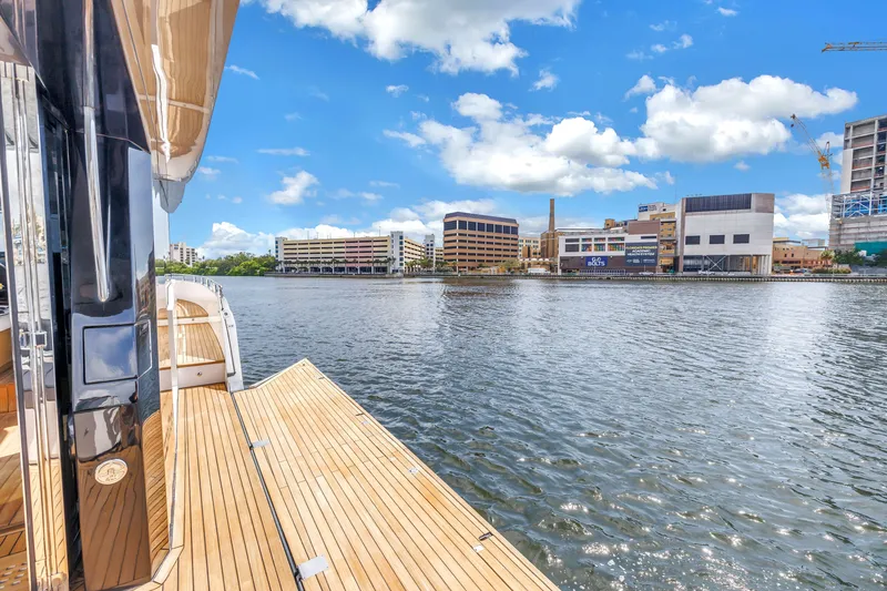Slide: The Image of Luxury OKEAN 50 Flybridge yacht docked by urban waterfront, 2022 model. - 82