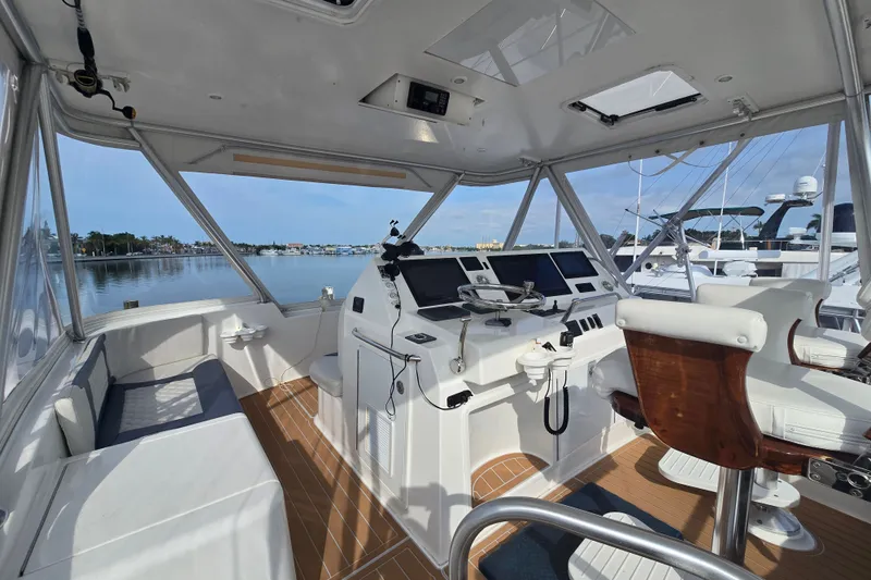 Slide: The Image of Interior view of 2006 Jersey Cape 44 Convertible yacht cockpit with modern controls and seating. - 31
