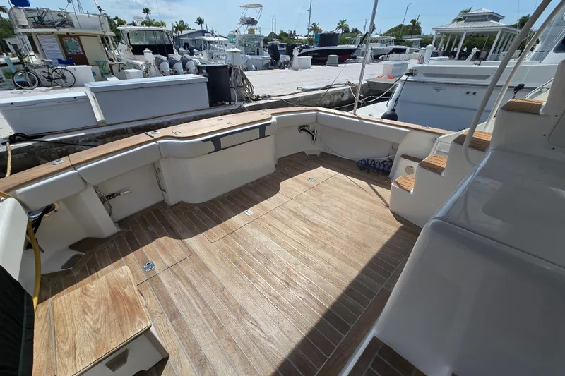 Slide: The Image of Spacious deck of 2006 Jersey Cape 44 Convertible yacht at marina. - 37