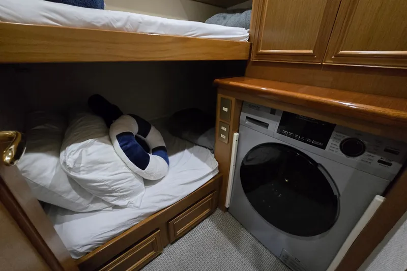 Slide: The Image of Interior of 2006 Jersey Cape 44 Convertible with bunk bed and washer-dryer unit. - 22