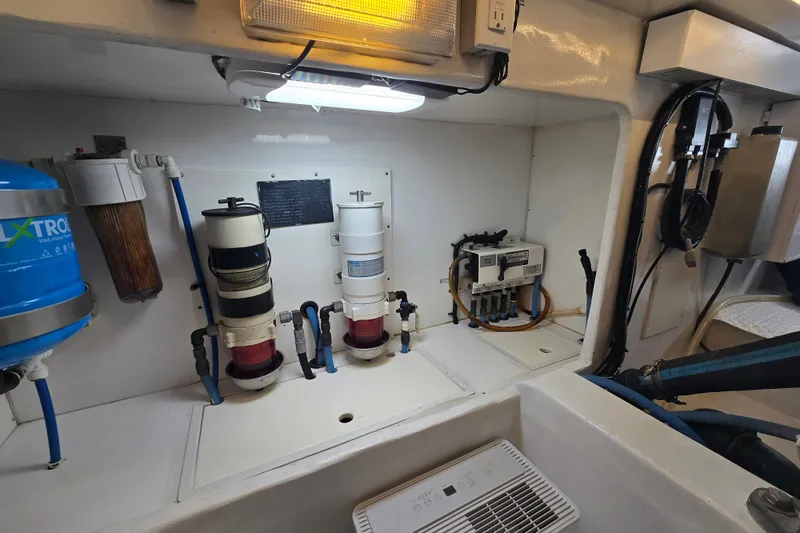 Slide: The Image of Engine room of 2006 Jersey Cape 44 Convertible with filtration systems and equipment. - 47