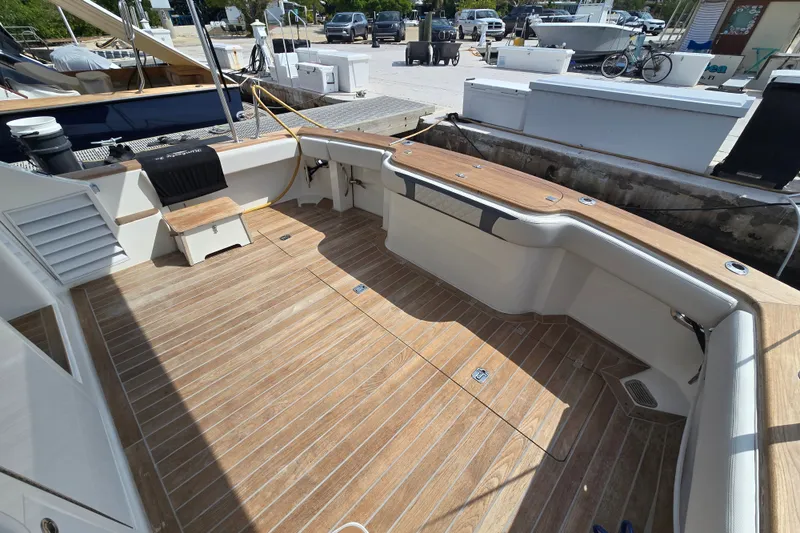 Slide: The Image of Spacious deck of 2006 Jersey Cape 44 Convertible yacht with wooden flooring. - 40