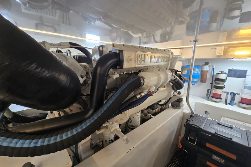 Slide: The Image of Engine room of a 2006 Jersey Cape 44 Convertible boat, featuring CAT Marine Power engine. - 43