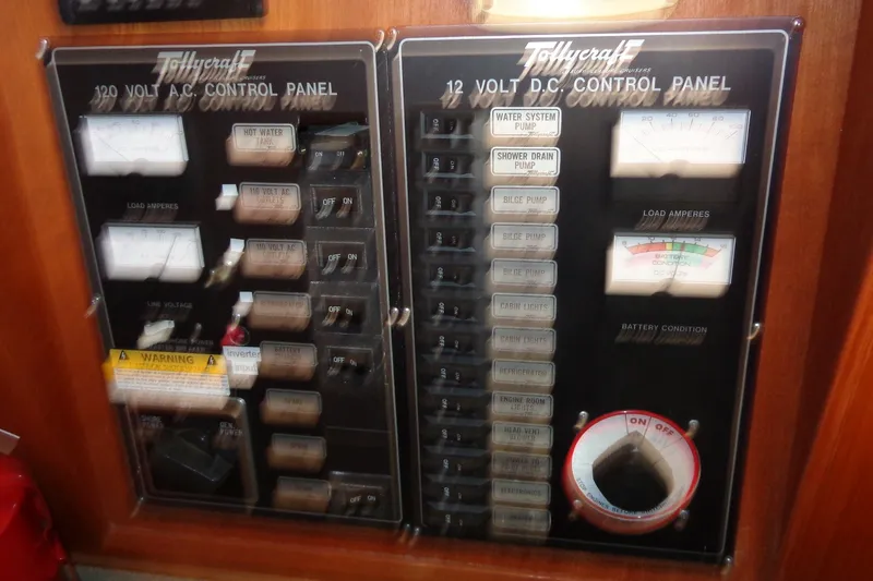 Slide: The Image of 1987 Tollycraft 34 Convertible Sedan control panels with switches and gauges. - 34
