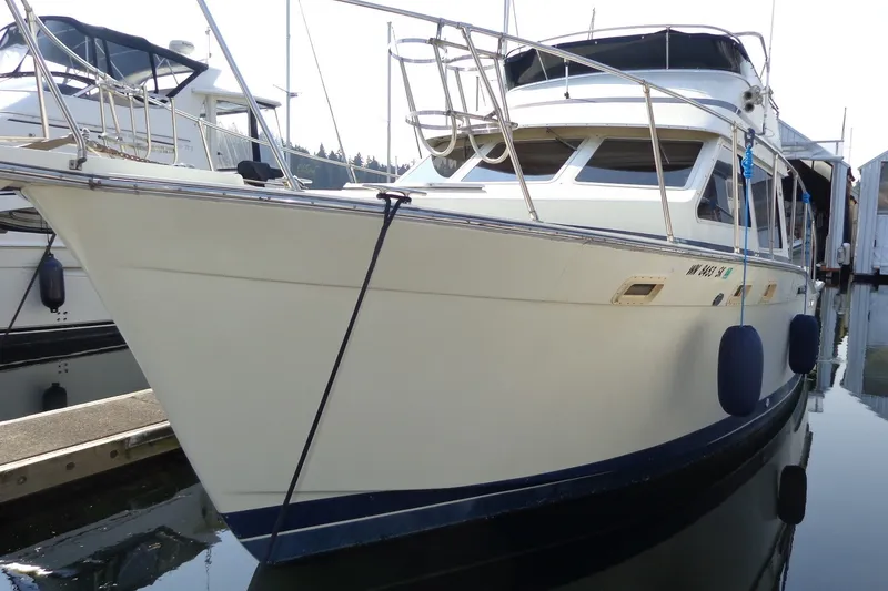 Slide: The Image of 1987 Tollycraft 34 Convertible Sedan yacht docked at marina, side view. - 3