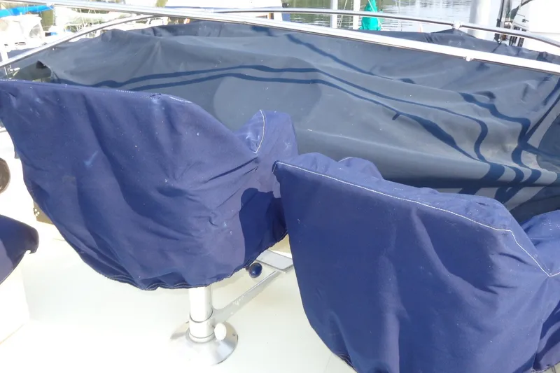 Slide: The Image of Blue-covered seats on 1987 Tollycraft 34 Convertible Sedan boat deck. - 28