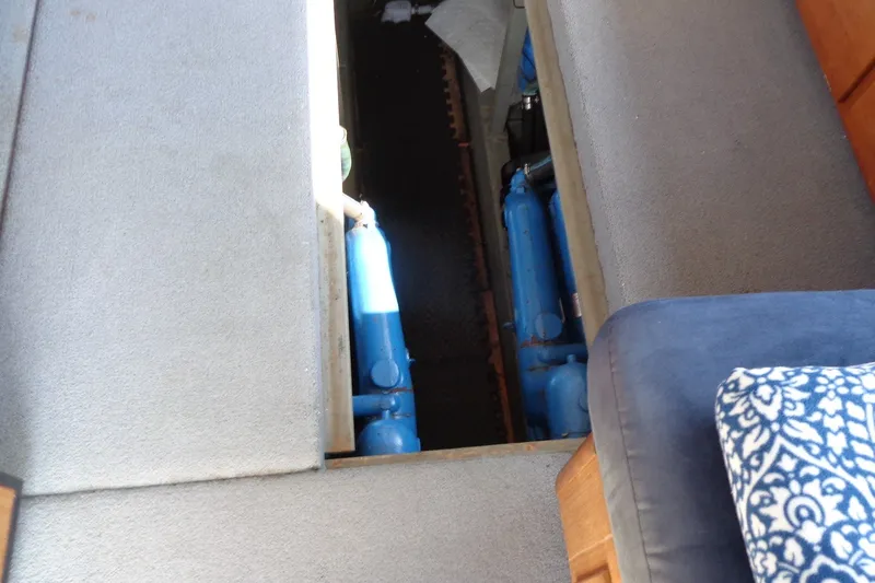 Slide: The Image of Engine compartment of 1987 Tollycraft 34 Convertible Sedan with visible blue machinery. - 30