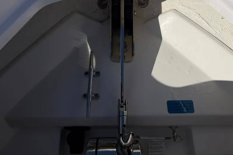 Slide: The Image of 2025 Sportsman Heritage 231 Center Console boat anchor setup in sunlight. - 18