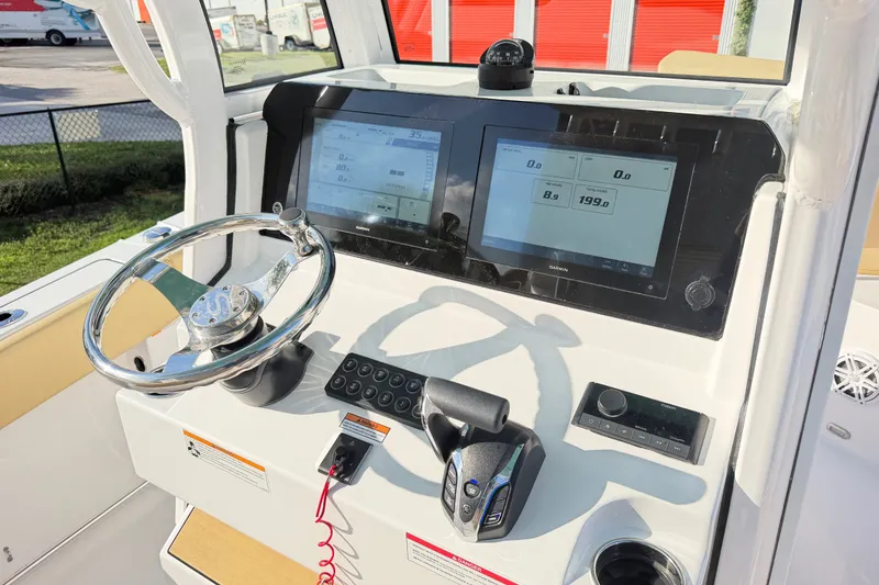 Slide: The Image of 2025 Sportsman Heritage 231 Center Console dashboard with dual displays and steering wheel. - 40