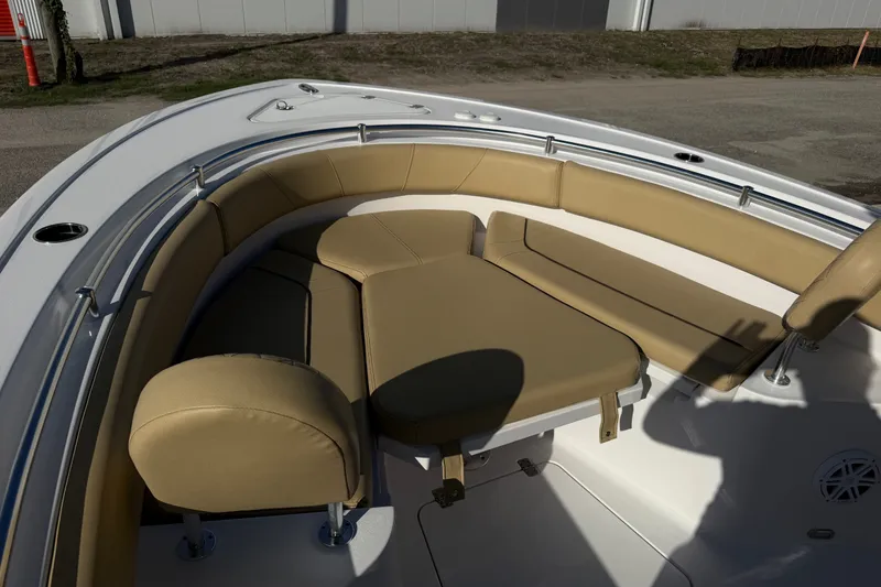 Slide: The Image of 2025 Sportsman Heritage 231 Center Console boat with tan cushioned seating area. - 27