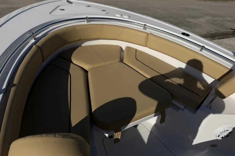 Slide: The Image of 2025 Sportsman Heritage 231 Center Console boat with tan cushioned seating area. - 16