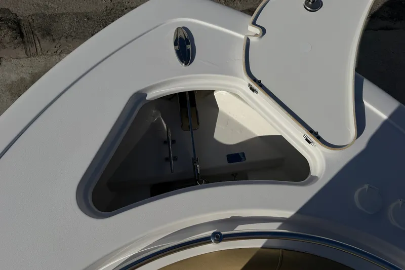 Slide: The Image of Open storage compartment on 2025 Sportsman Heritage 231 Center Console boat. - 19
