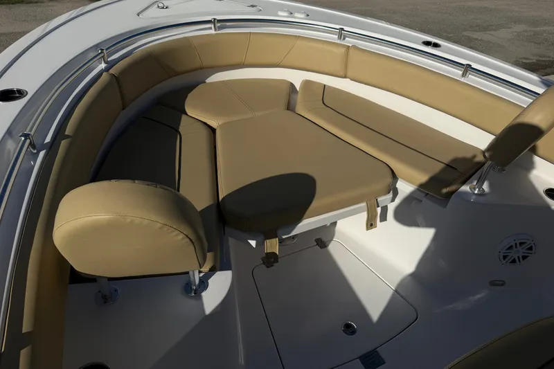 Slide: The Image of 2025 Sportsman Heritage 231 Center Console boat with tan cushioned seating area. - 22