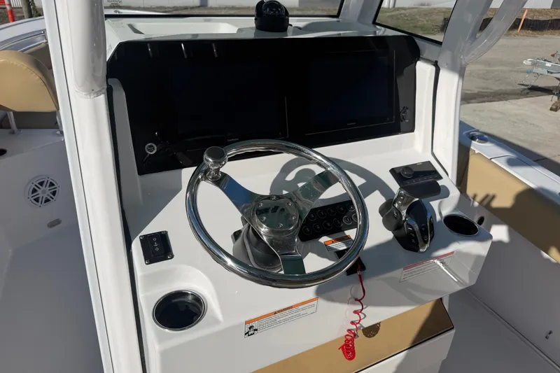 Slide: The Image of 2025 Sportsman Heritage 231 Center Console helm with steering wheel and controls. - 29
